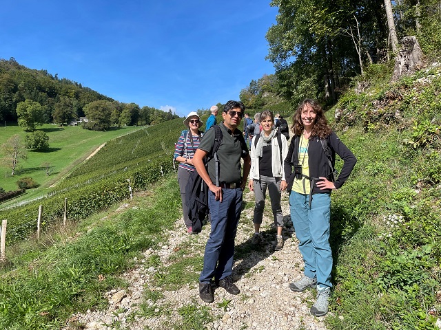 Group of Centrepoint members on a sunny Sunday walk through a vineyard