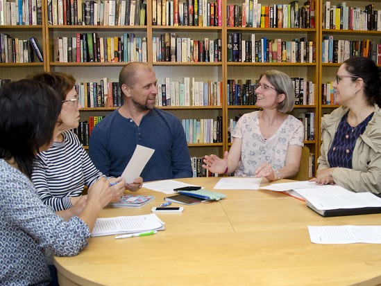 Five Centrepoint members talking in a language conversation group in the Centrepoint library
